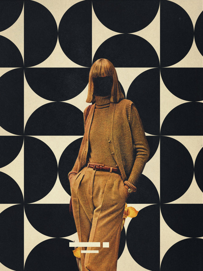 Vintage-styled woman in brown suit stands before a bold black and white geometric backdrop. 1978 Annie Collection.