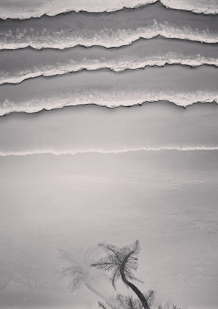 A breath before the shore by KG Studio - four lines of thick white surf and two palms held entirely in greys