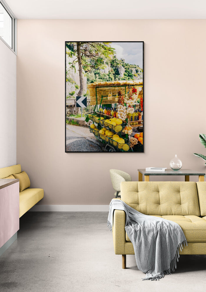 Framed Amalfi Coast Drive XV print on a beige wall above a stylish, modern living room interior.