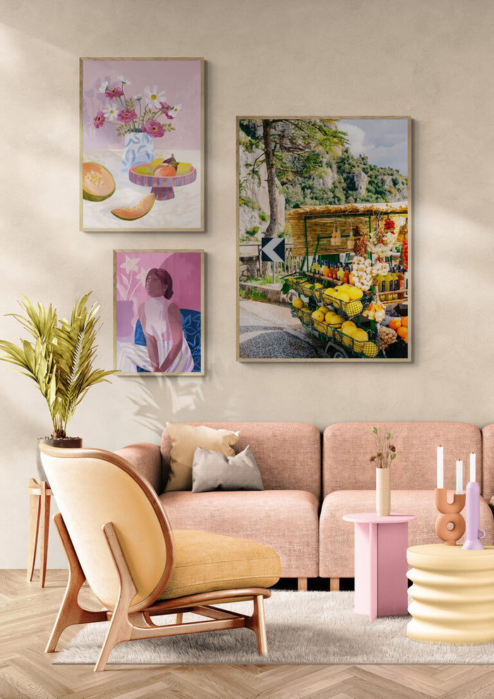 Amalfi Coast Drive XV wall art displayed in a cozy, modern living room with pastel decor and houseplants.