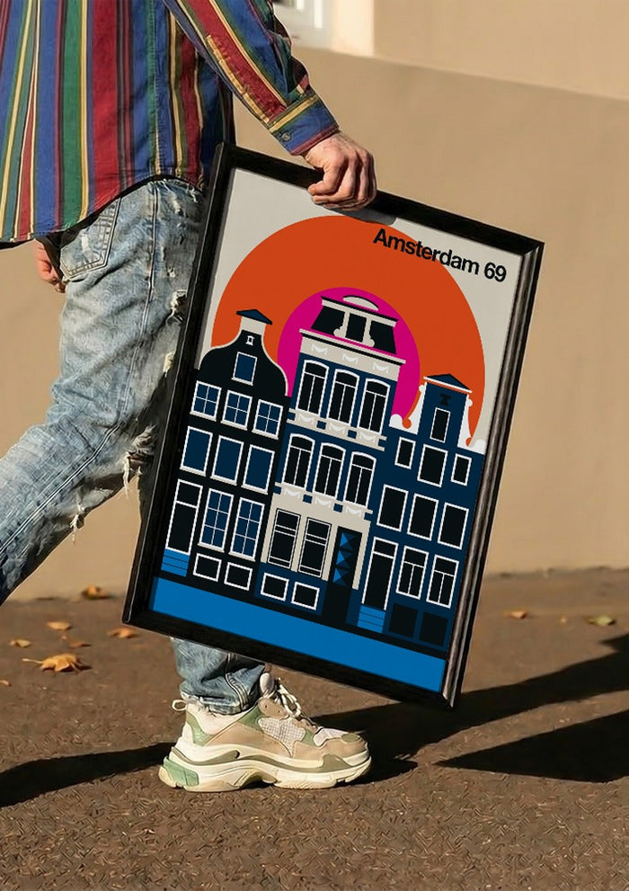 Amsterdam 69 by Bo Lundberg carried in a black frame along a sunny street