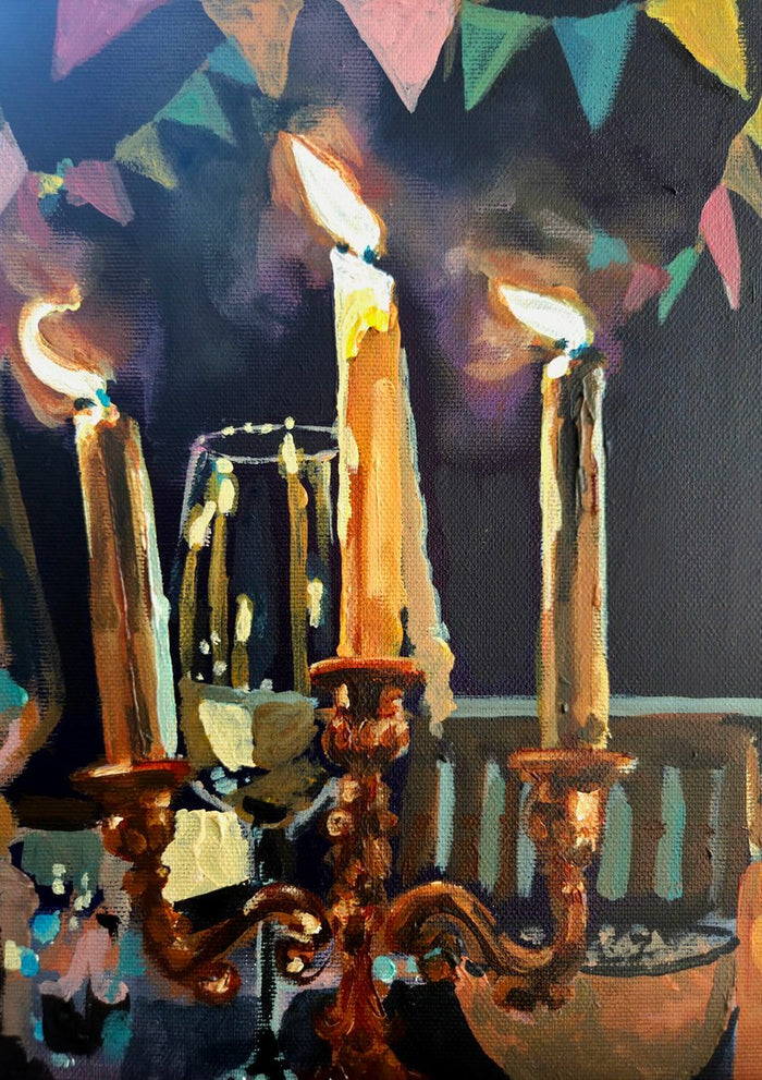 An October birthday by Mariam De Giorgio — three lit candles on a brass candelabra with pastel bunting against a deep purple background.