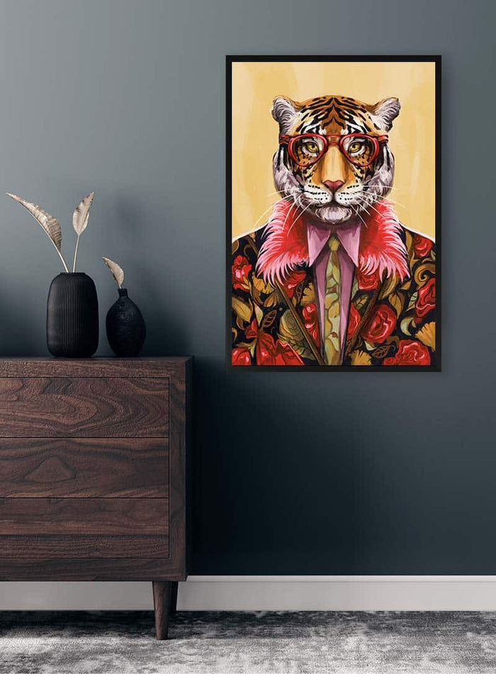 Framed "Artsy Fartsy Tiger - Vincent V" artwork on a dark wall above a wooden dresser with vases.