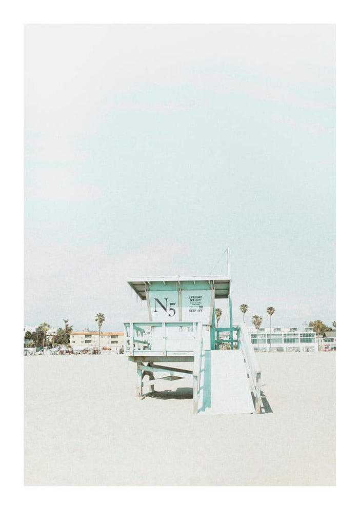 Minimalist beach tower with "N5" sign, sandy foreground, pastel sky; Beach Tower Naturposter product image.