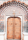 Ornate wooden door in Marrakech with intricate carvings and colorful geometric patterns, featured on a decorative poster.
