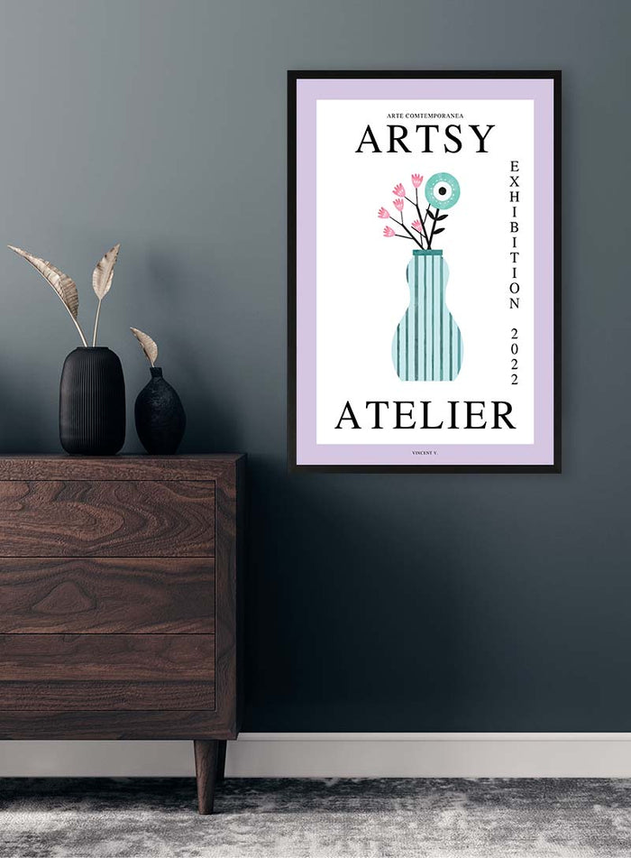 Framed Blue Vase - Vincent V. print on a dark gray wall above a wooden dresser with minimalist decor.