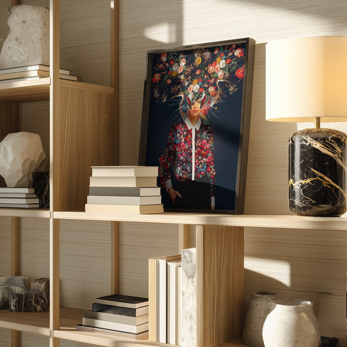 Framed Bright Bloom artwork by Frank Moth displayed on a wooden shelf beside books, decor items, and a lamp.