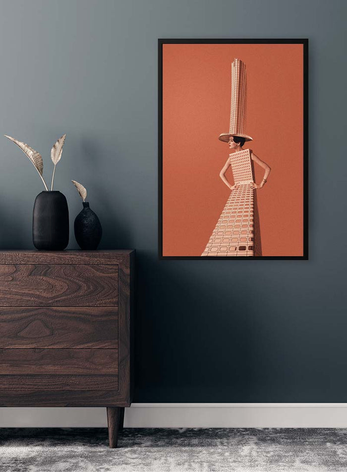 Framed artwork "City girl" by Maarten Léon on a modern interior wall above a dark wooden dresser.