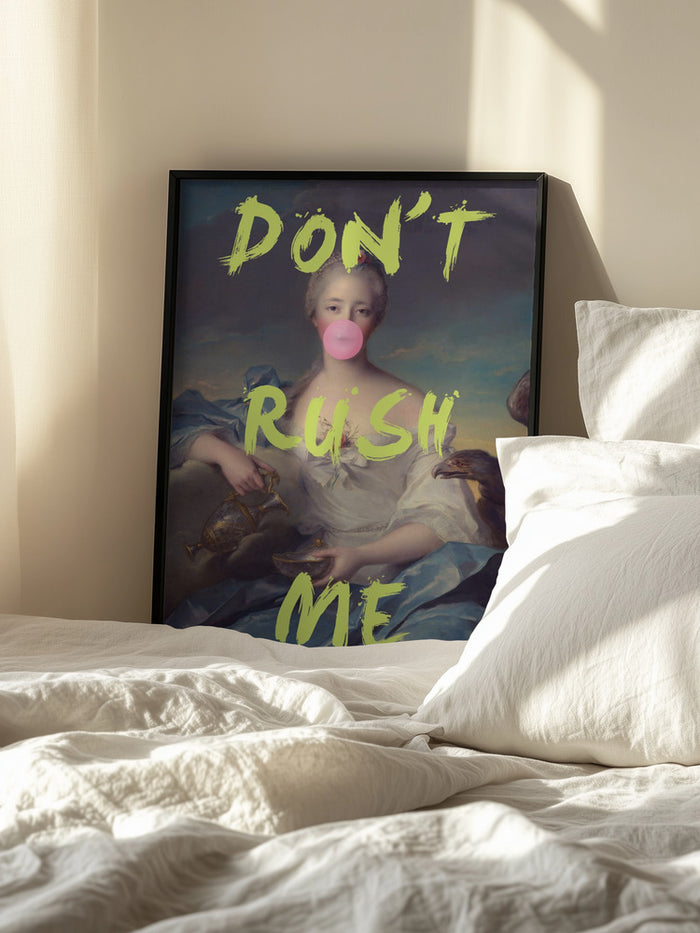Framed "Don't Rush Me Portrait" by Talitha McQueen resting on a bed with sunlight streaming in.
