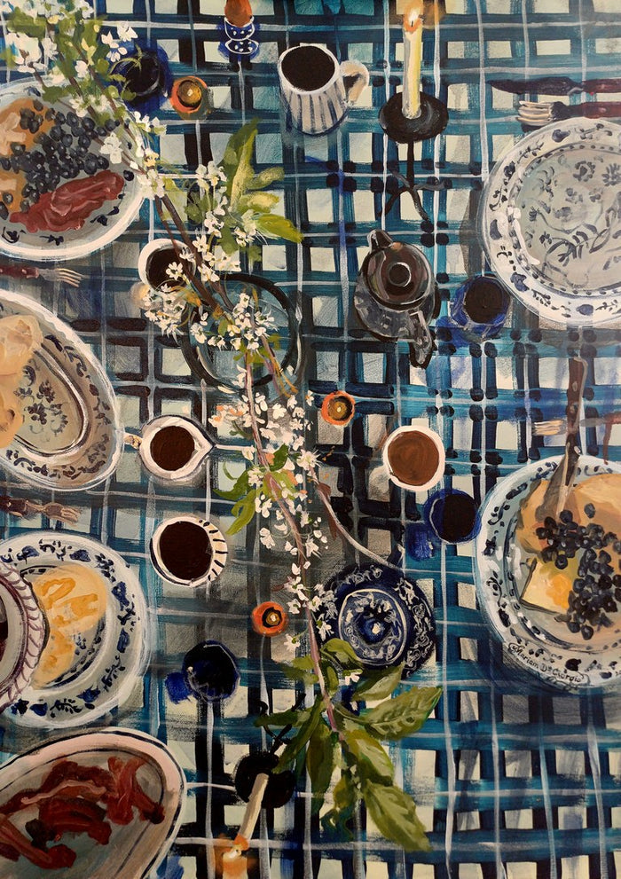 Easter Breakfast by Mariam De Giorgio - a blue and white checked table of cake, coffee and white blossom from above