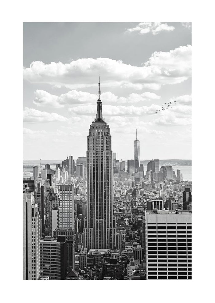 Black and white poster of the Empire State Building towering over the New York City skyline.