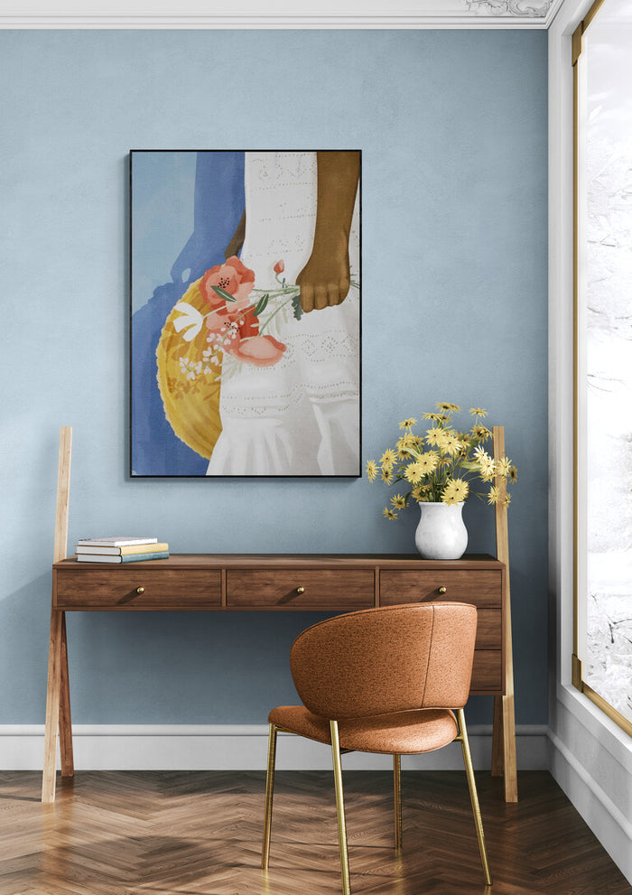 Feeling Blue - Goed Blauw artwork on a blue wall above a wooden desk with flowers and a brown chair.