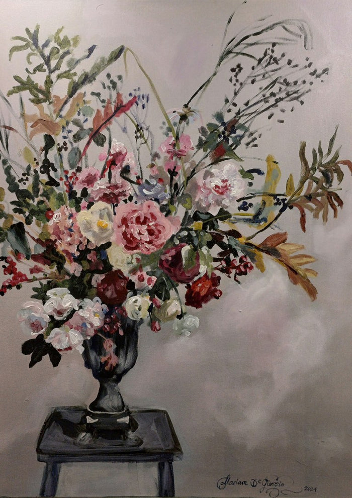 Floral arrangement on Grandmother's stool by Mariam De Giorgio - tall bouquet of pink roses and grasses in a grey urn on a stool