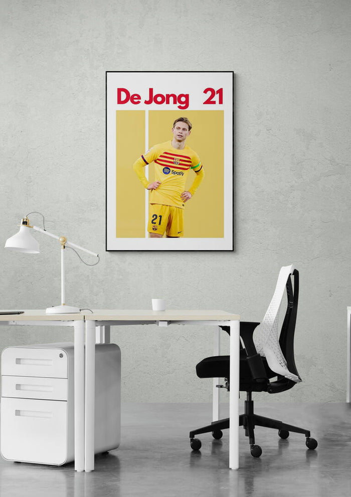 Frenkie de Jong Football Poster featuring player in yellow kit with "De Jong 21" text, displayed above a desk.