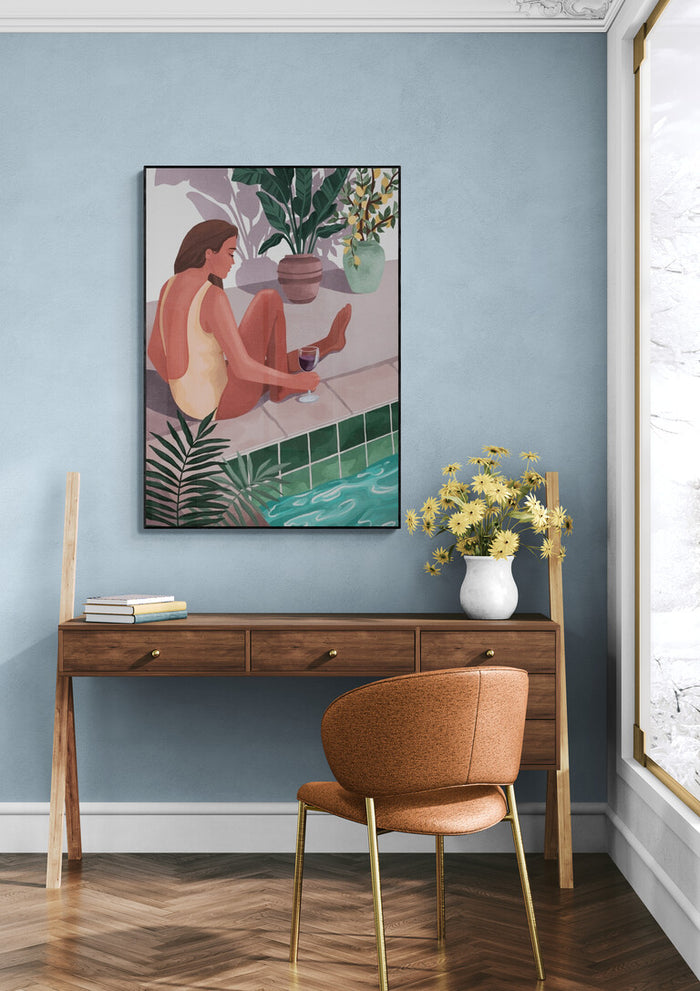 Framed "I Bet You Think About Me - Goed Blauw" art above desk in modern, light blue room with brown chair.