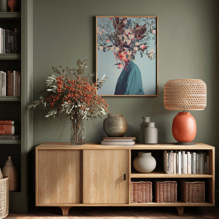 Framed "I Was Hidden but You Saw Me" by Frank Moth displayed above a wooden sideboard in a styled living room.