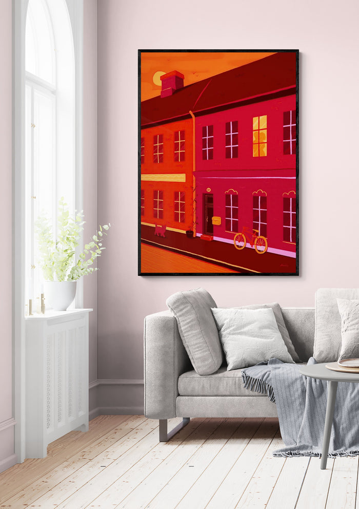 Colorful artwork "The Embrace of Light" by Nanna Paavig hanging above a modern sofa in a bright living room.