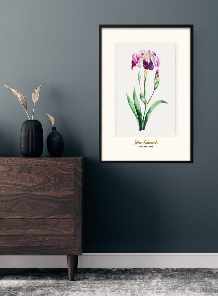 Framed Japanese Iris art print by John Edwards hanging above a wooden dresser in a modern room.