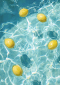 Lemon pool by Ohkimiko - five yellow lemons floating on sunlit turquoise pool water