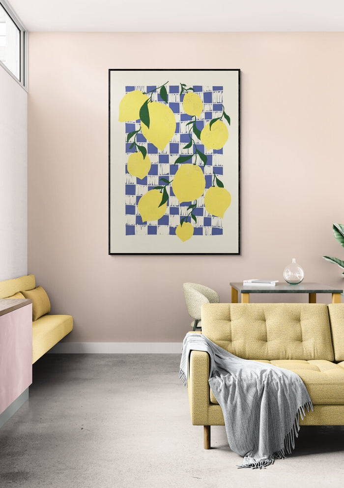 Framed artwork of bright yellow lemons on a checkered background, displayed in a modern living room.