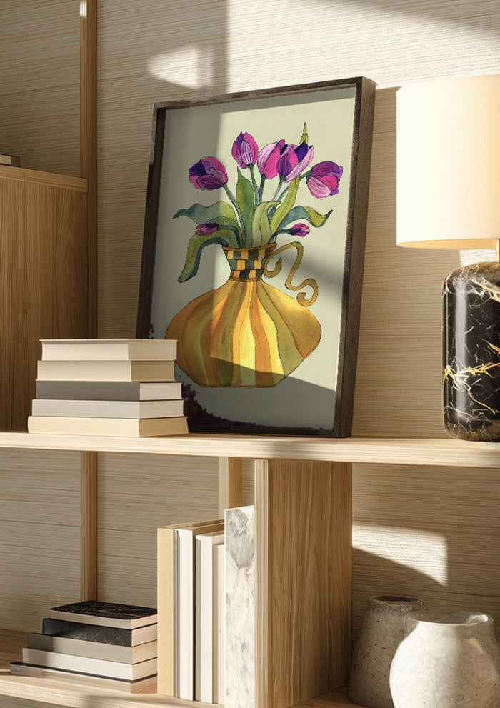 Lilac tulips by Marjorie Salvagni in a dark frame on a wooden shelf beside books and a lamp