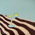 Lime by Elva Garma - aqua cocktail glass with lime slices on a brown and cream striped cloth
