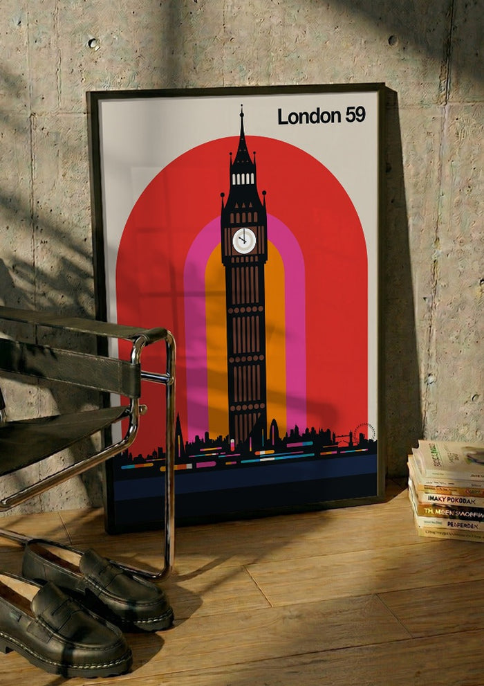 London 59 by Bo Lundberg in a black frame leaning against a concrete wall by a steel chair