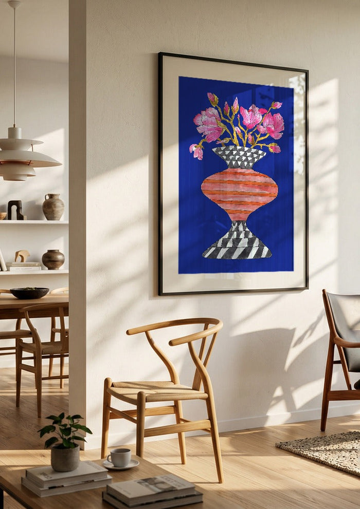 Lush Magnolia by Marjorie Salvagni in a black frame in a bright dining room with wooden chairs