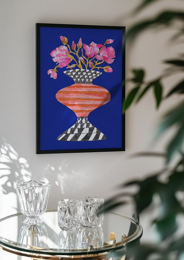Lush Magnolia by Marjorie Salvagni in a black frame above a glass table with crystal glassware