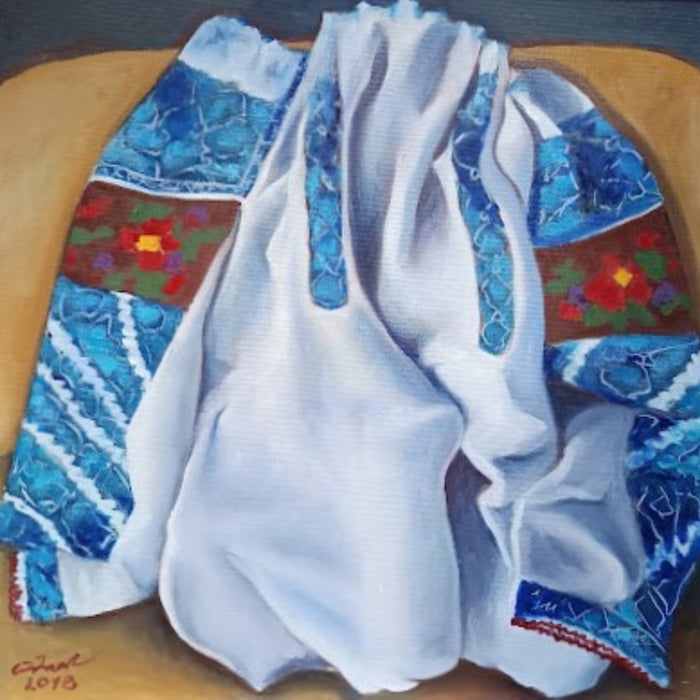 Mother's Blouse by Cristina Iacob - an embroidered white linen blouse with turquoise needlework on ochre