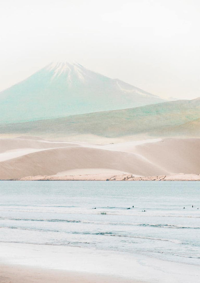 Minimalist print of a serene beach with gentle waves and a misty mountain in the background.