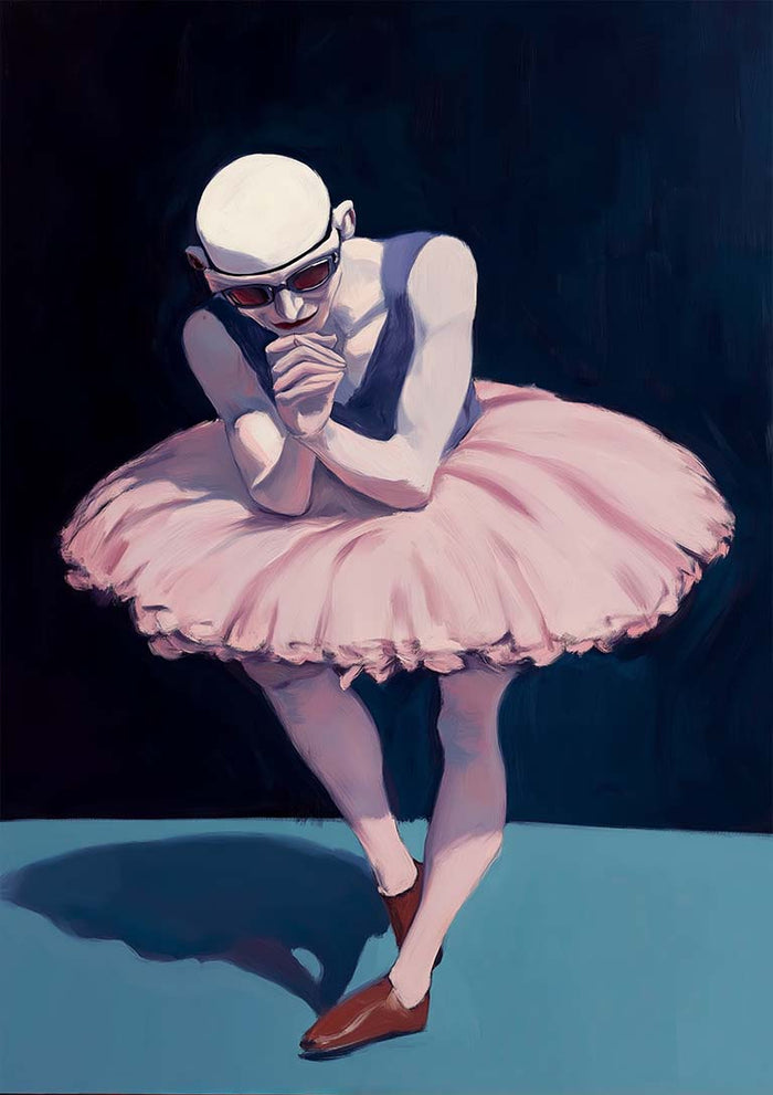 A male ballet dancer in a pink tutu and brown shoes stands poised under dramatic lighting.