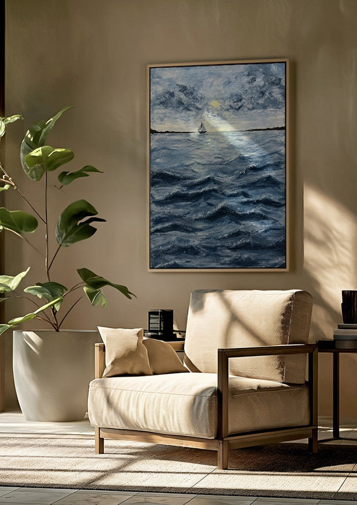 Ocean for my sister by Maya framed above a beige armchair beside a potted plant