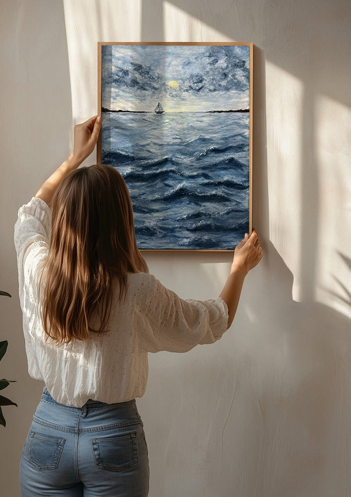 Ocean for my sister by Maya being hung on a sunlit wall