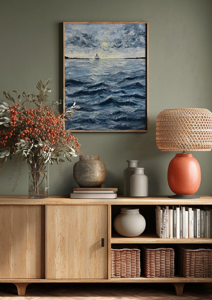 Ocean for my sister by Maya above a wooden sideboard on a sage green wall