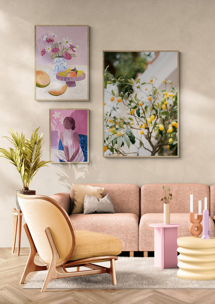 Modern living room with soft pink sofa, pastel decor, and Orange Capri artwork on the wall above the couch.