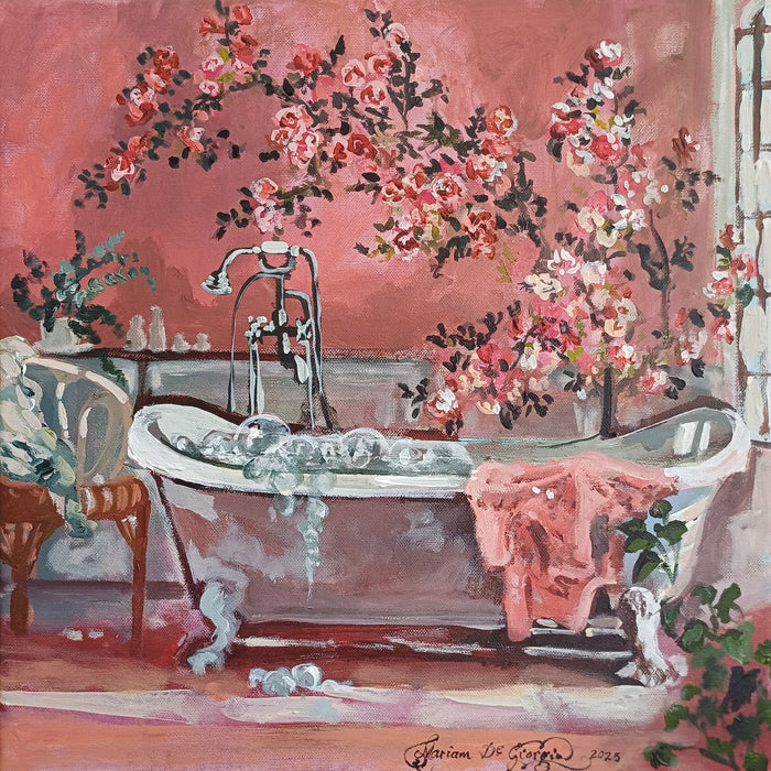 Pink bathroom by Mariam De Giorgio — a foam-filled claw-foot bathtub against a coral wall of climbing roses