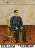 Frida Kahlo seated in a suit on a yellow chair, with cropped hair and cut locks on the floor.