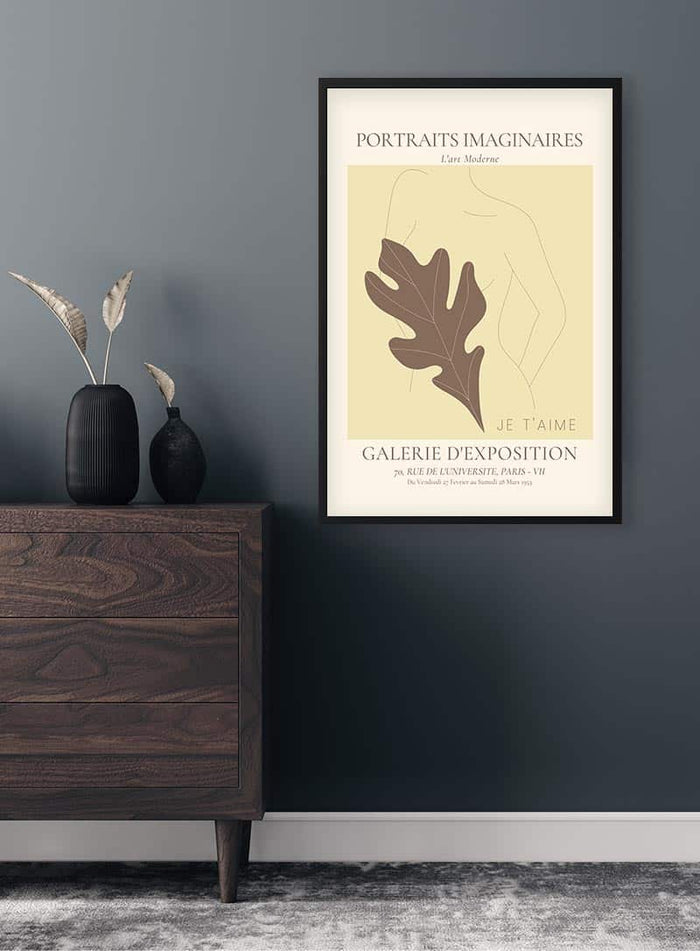 Minimalist art poster with abstract female form and leaf, titled "Portraits Imaginaires Woman No. 2" above a dresser.