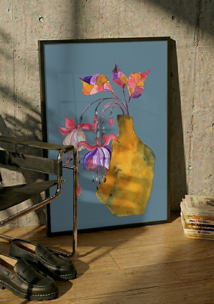 Princess earring by Marjorie Salvagni in a black frame leaning against a concrete wall by a steel chair