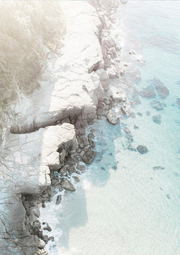 Aerial view of a rocky beach with turquoise water featured on the Rocky Beach Plakat product page.