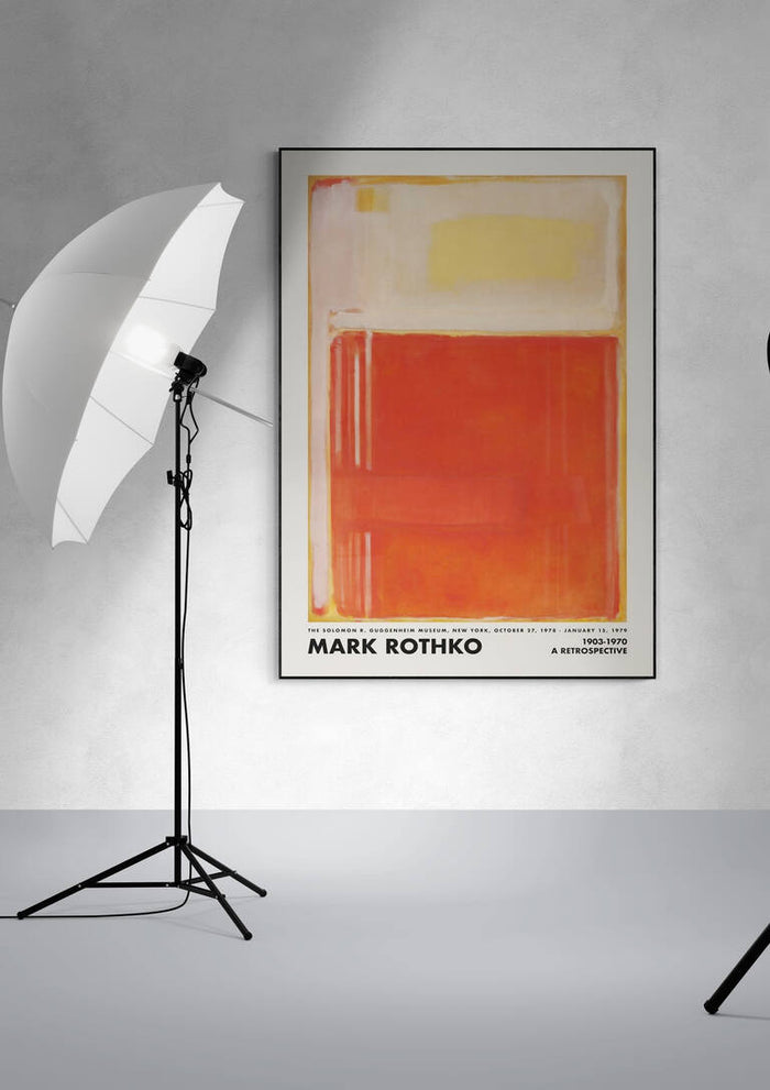 Framed Rothko Orange Perspective artwork on a wall, with studio lights positioned on either side.