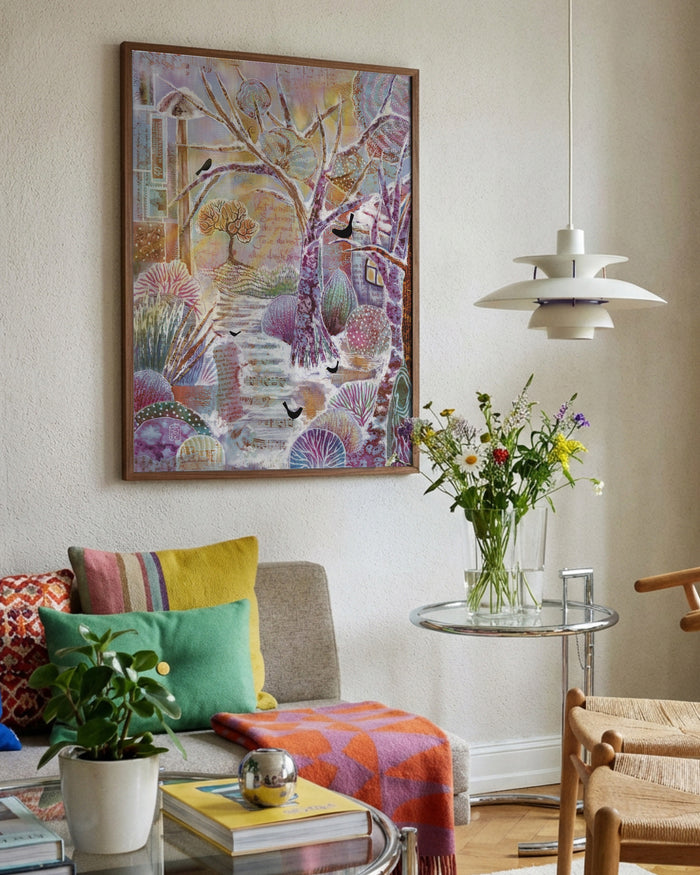 Snowy Sanctuary by Enikő Marosváry-Kramcsák framed in a bright living room
