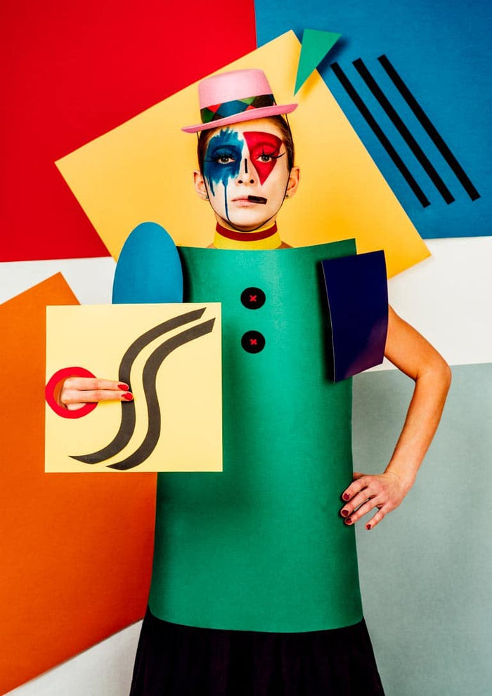 Suprematist portrait of Lena Naymkina with geometric costume and abstract, colorful background.