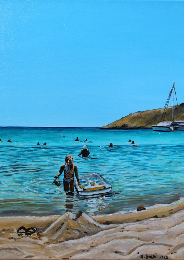 Swimming in the Lagoon by Nella Hajdu - woman wading out of a turquoise lagoon with a lilo
