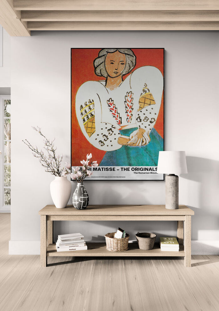Framed "The Romanian Blouse - Henri Matisse" artwork above a wooden console table in a modern living room.