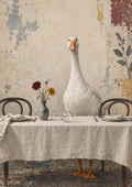 The Uninvited Guest by Matthews Gallerie — a white goose standing at a laid dining table with flowers and a toppled wine glass