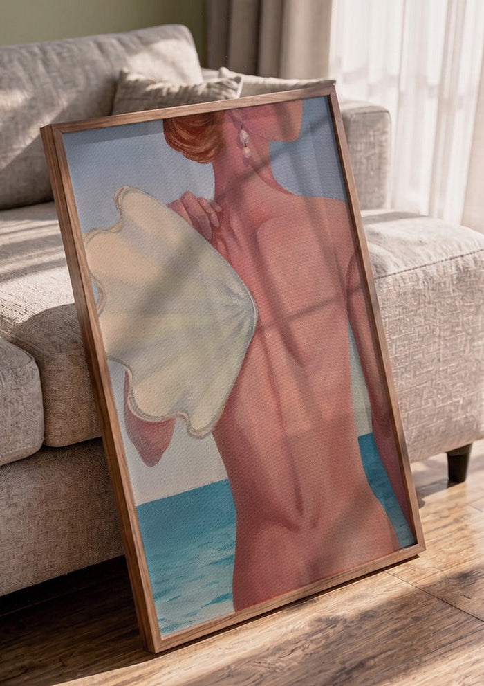 The wing by NeReid in a walnut frame leaning against a grey sofa