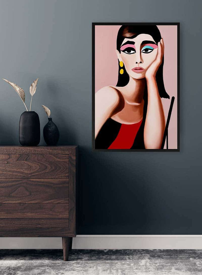 Framed "Thoughts of Audrey" by David Wolf displayed on a dark wall above a wooden dresser in a modern room.