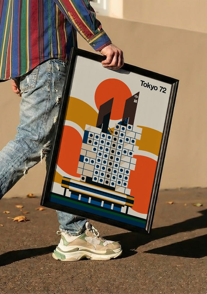 Tokyo 72 by Bo Lundberg carried in a black frame along a sunny street